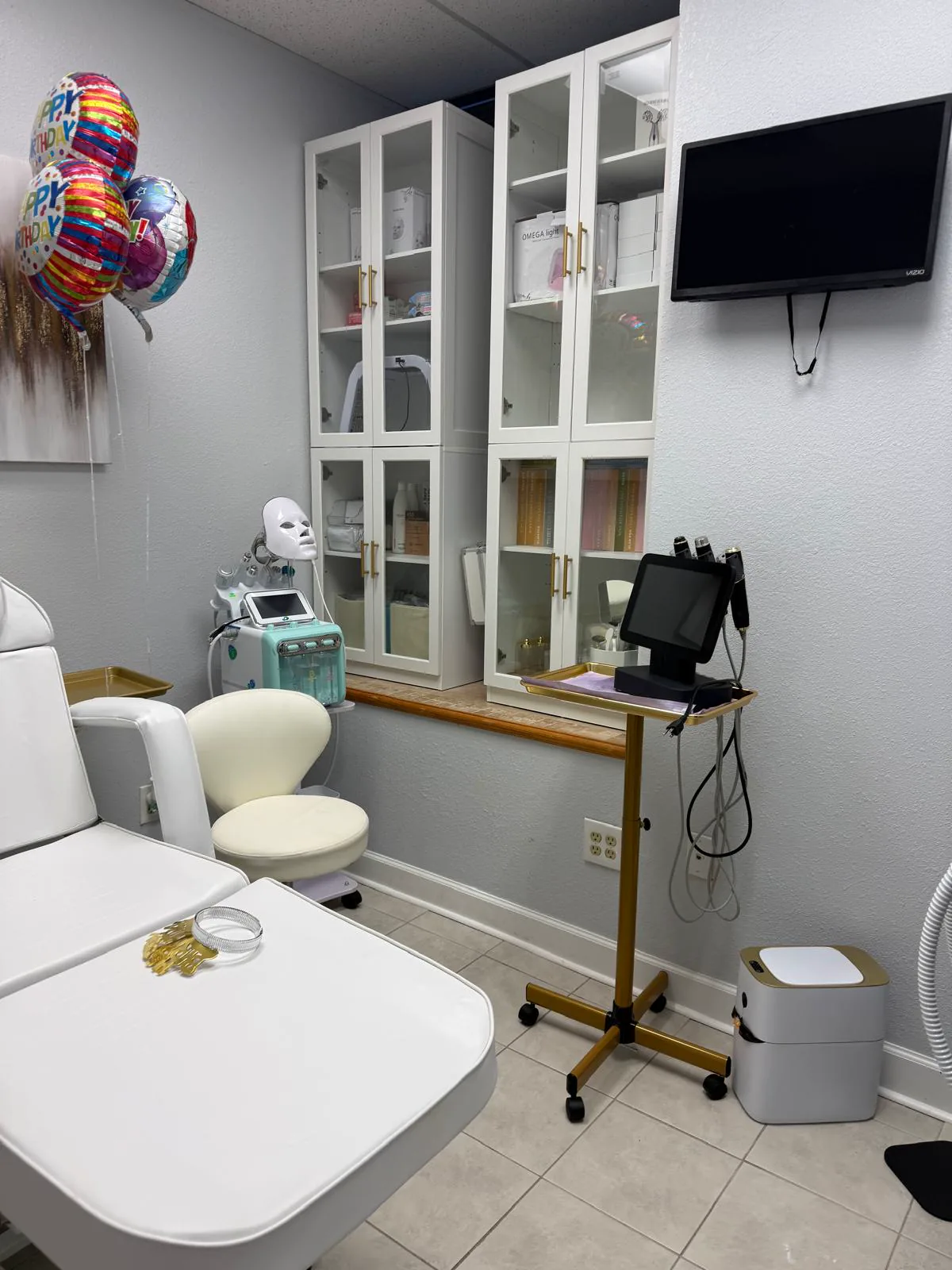 Facial suite with LED light therapy mask and clinical equipment